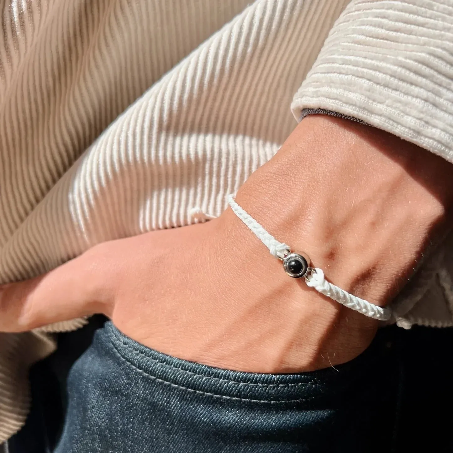 Handcrafted custom photo projection bracelet in silver with white rope, featuring alloy pendant with gold-plated inlaid artificial gemstones