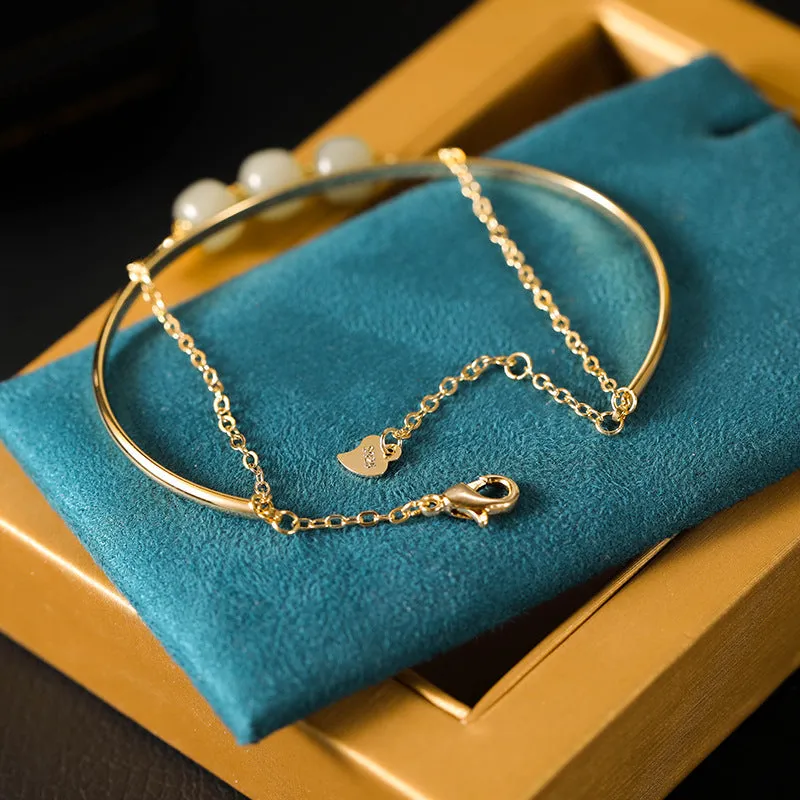 Women's jade lucky beads bracelet with gold inlay treatment showing single, double, and three beads versions