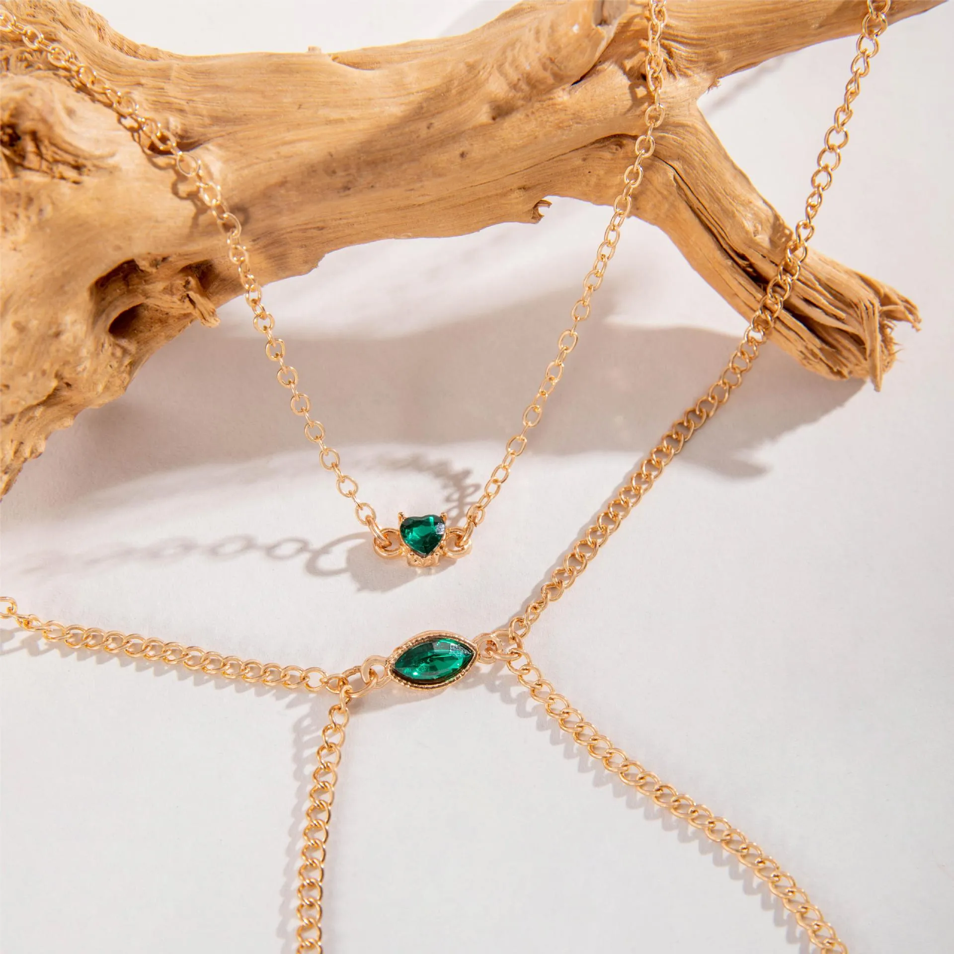 Men's simple gold-toned alloy body chain necklace with electroplated 25729 gold finish on a plain background.