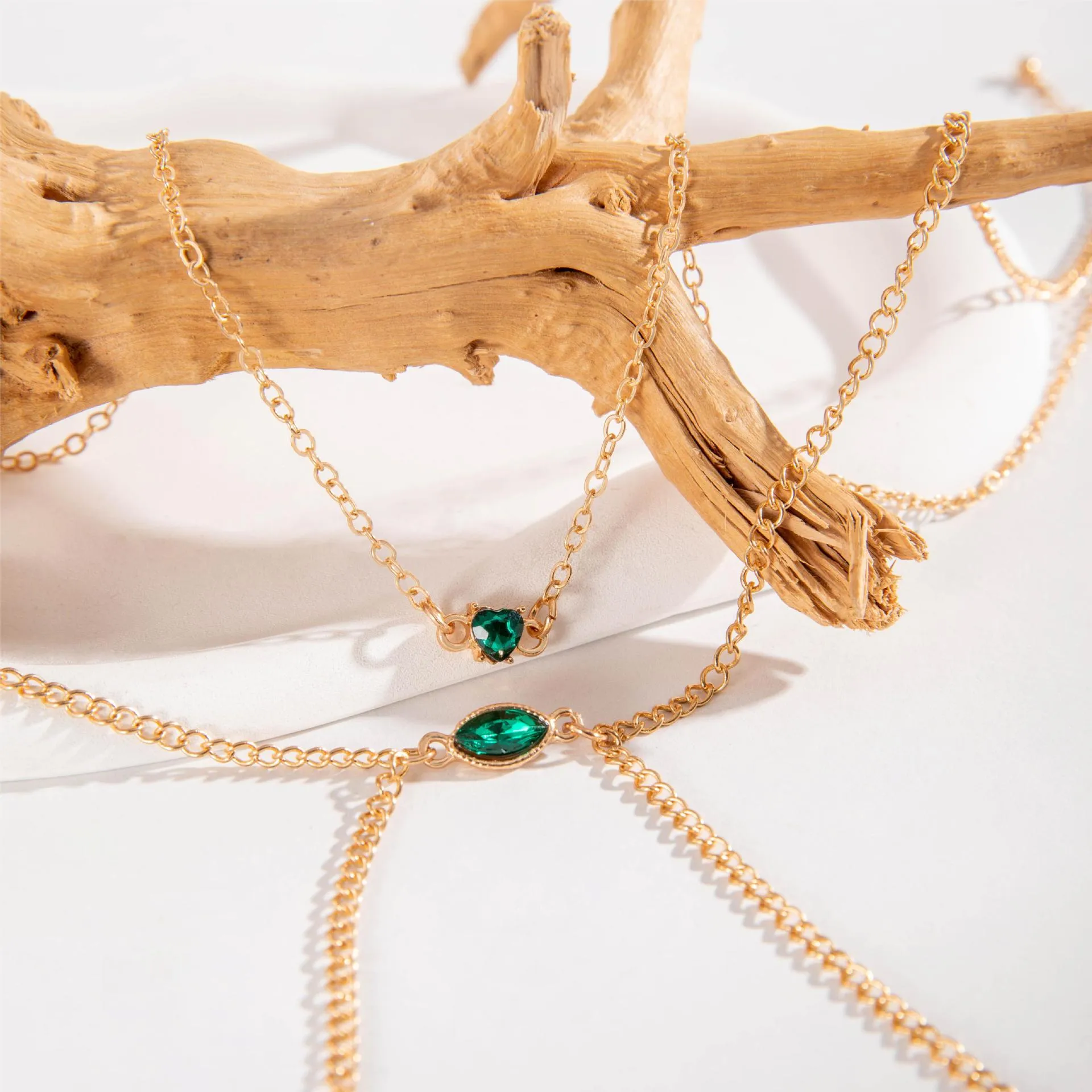 Men's simple gold-toned alloy body chain necklace with electroplated 25729 gold finish on a plain background.