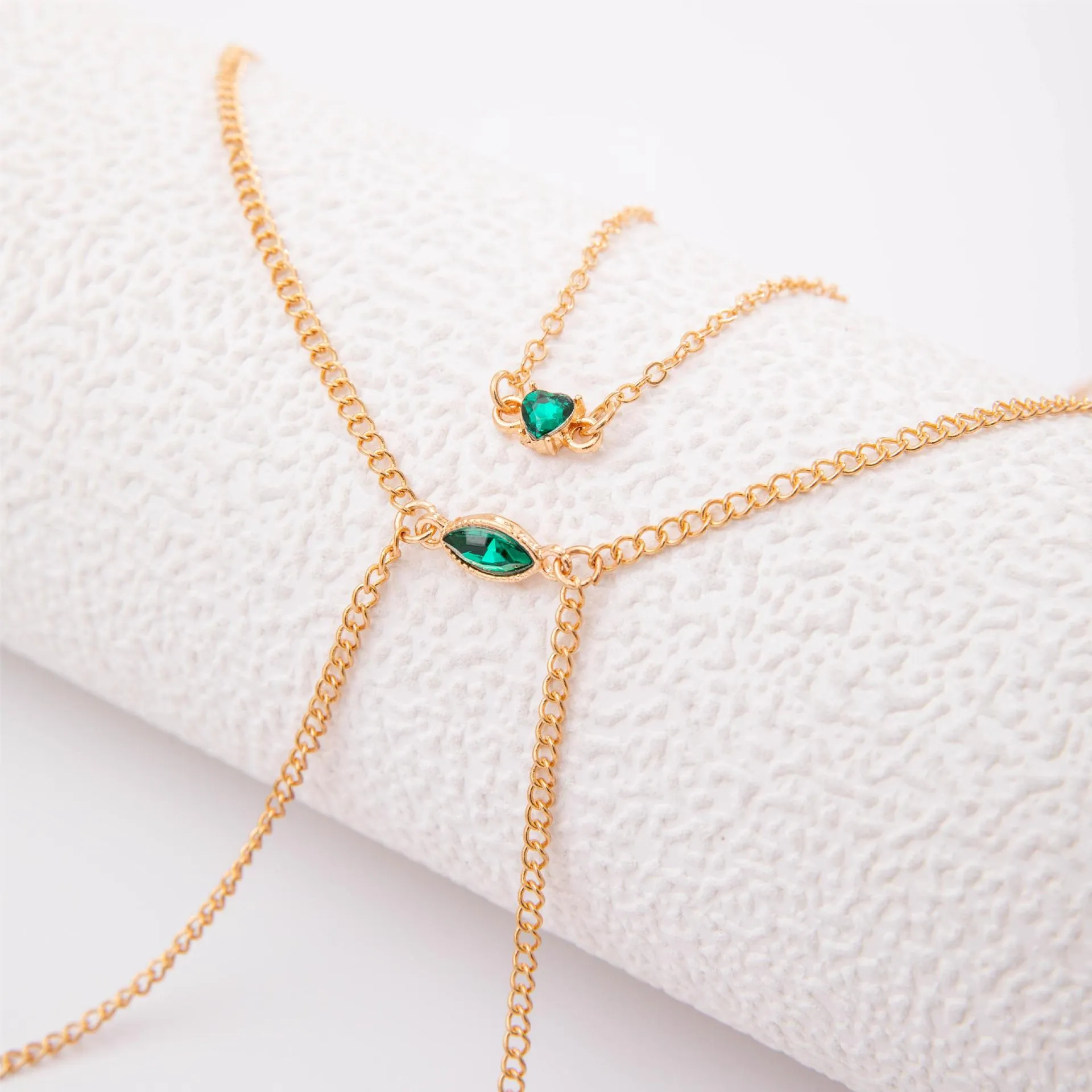 Men's simple gold-toned alloy body chain necklace with electroplated 25729 gold finish on a plain background.