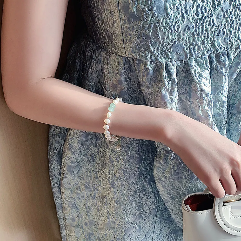Women's irregular freshwater pearl adjustable bracelet on a plain background showing the alloy clasp and irregular pearl beads