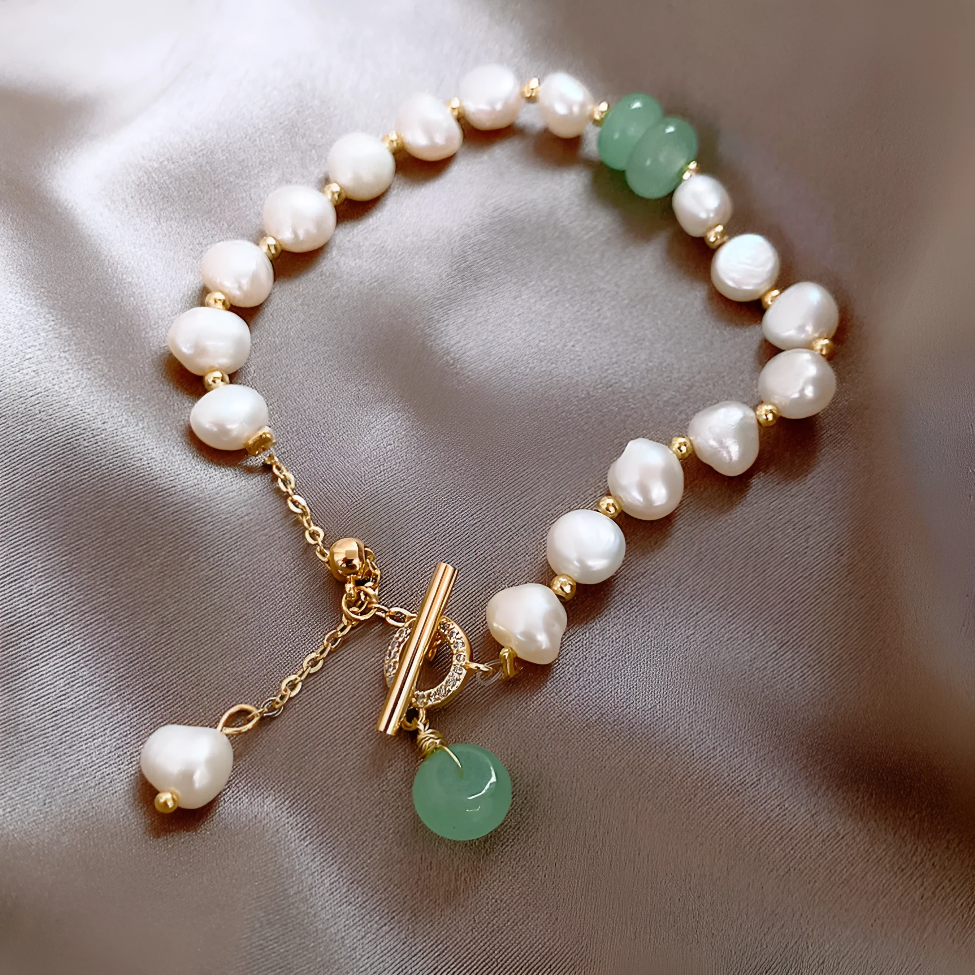 Women's irregular freshwater pearl adjustable bracelet on a plain background showing the alloy clasp and irregular pearl beads