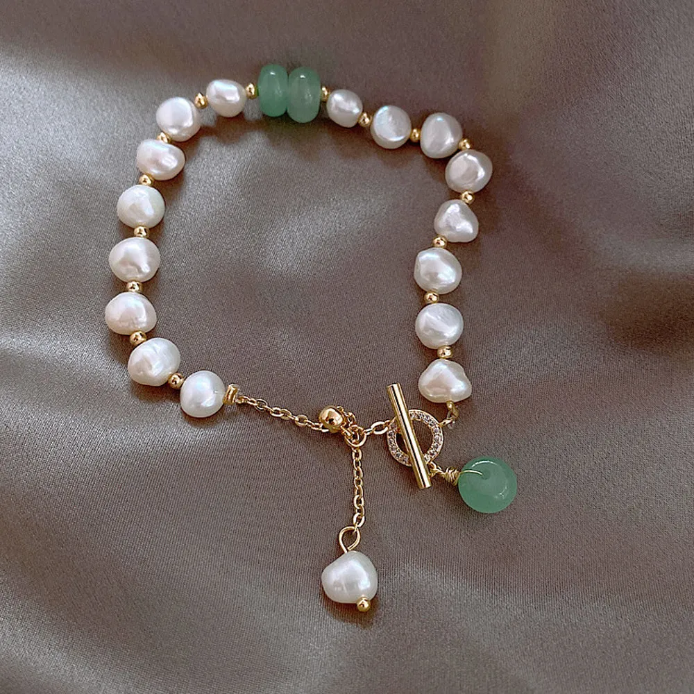 Women's irregular freshwater pearl adjustable bracelet on a plain background showing the alloy clasp and irregular pearl beads