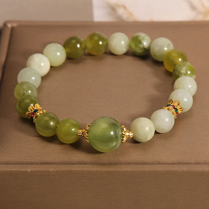 Xiuyan jade green women's bracelet with sweet Mori style design on a wrist.