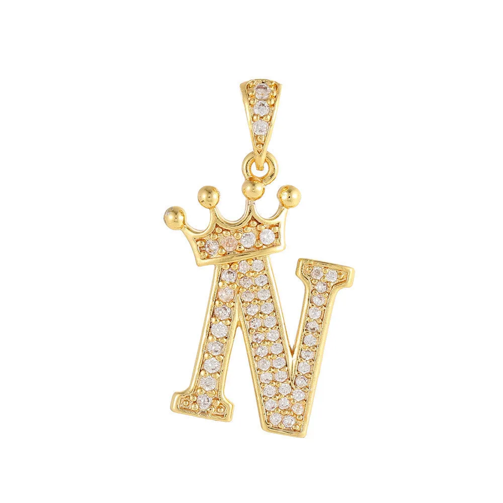Gold plated copper letter A pendant with inlaid zircon crown and diamond cut surface on white background