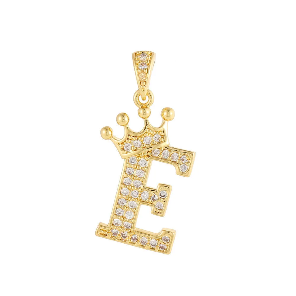 Gold plated copper letter A pendant with inlaid zircon crown and diamond cut surface on white background