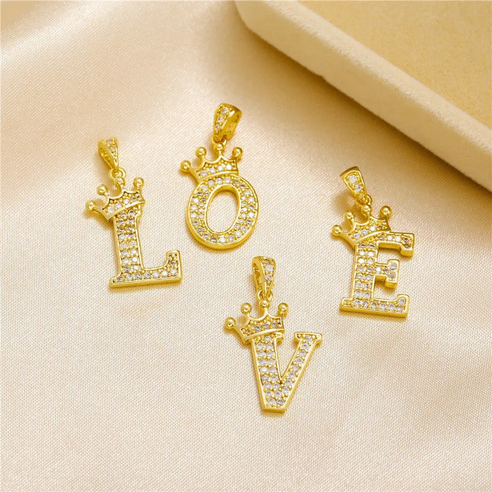 Gold plated copper letter A pendant with inlaid zircon crown and diamond cut surface on white background