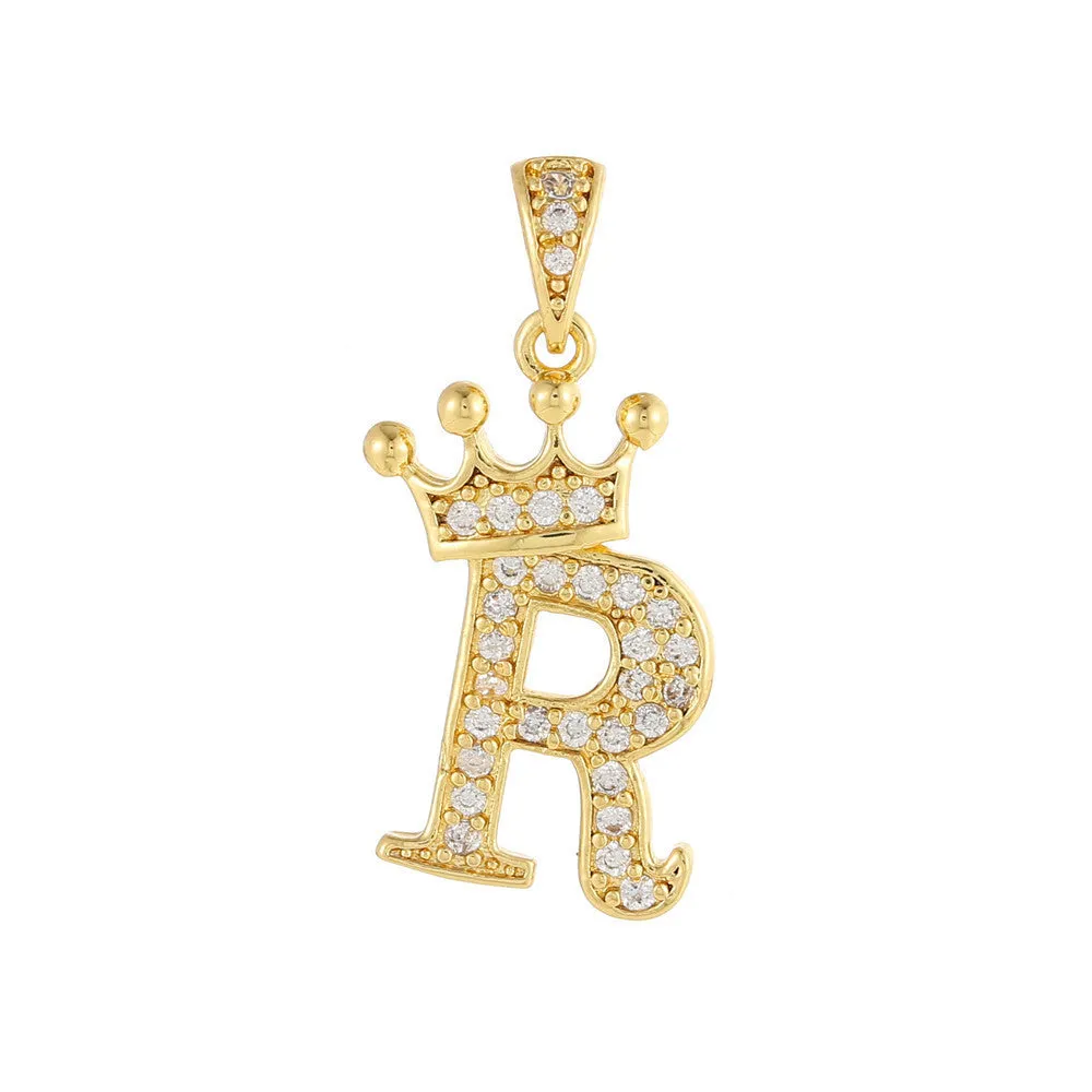 Gold plated copper letter A pendant with inlaid zircon crown and diamond cut surface on white background