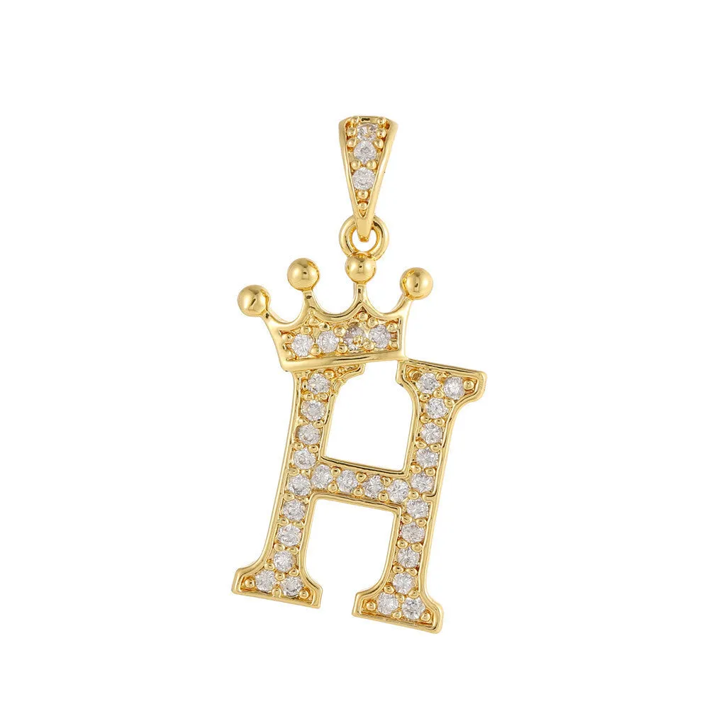 Gold plated copper letter A pendant with inlaid zircon crown and diamond cut surface on white background
