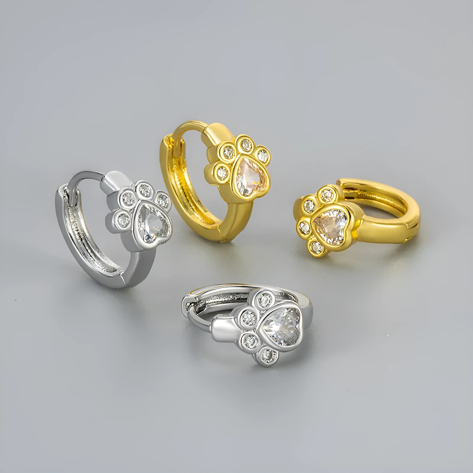 Cat paw zircon ear studs in gold and white gold copper finish