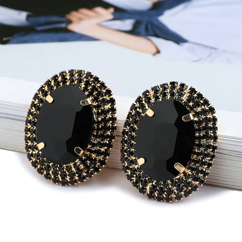 Women's oval rhinestone ear studs in eight colours including red, green, purple, black, white, pink, champagne, and AB finish