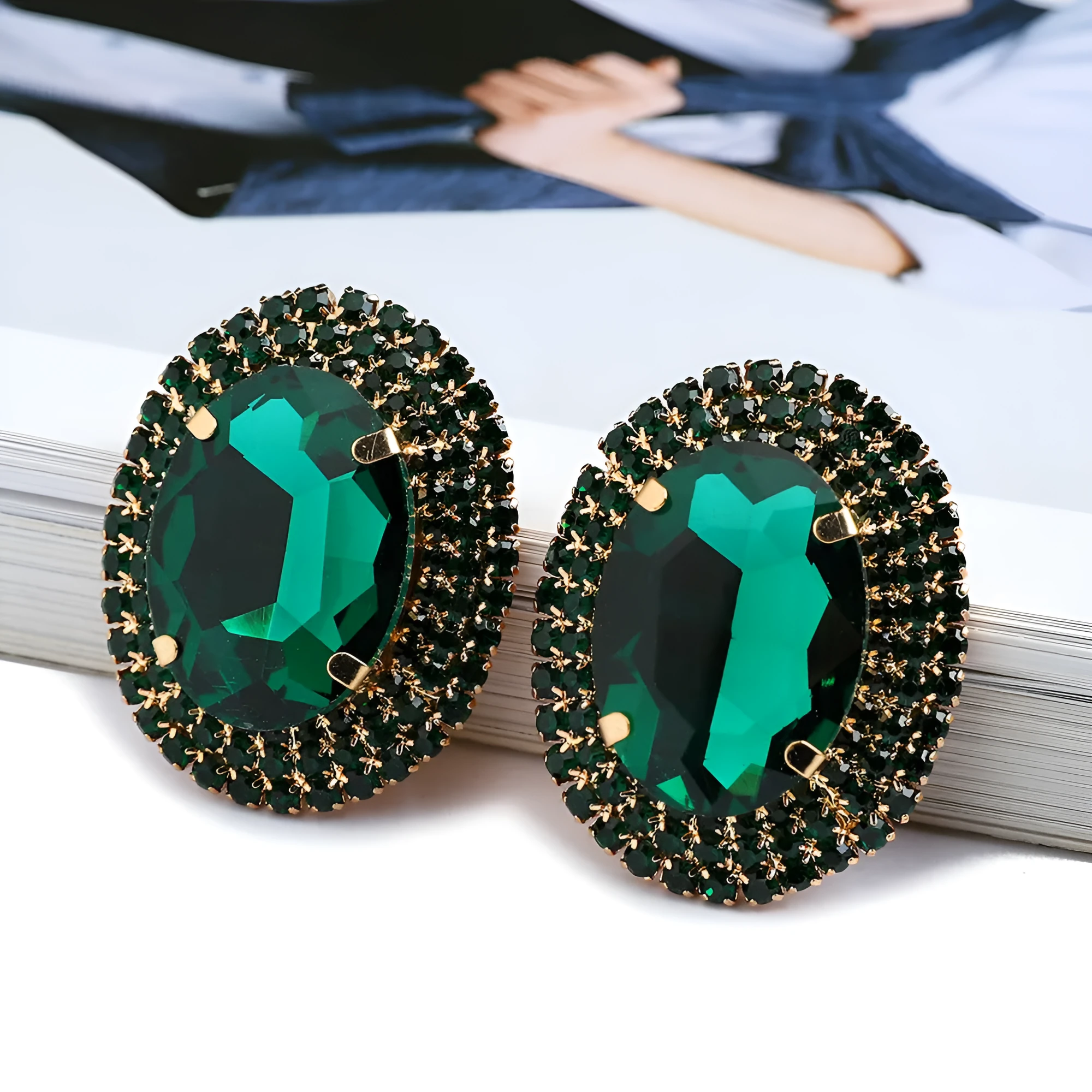 Women's oval rhinestone ear studs in eight colours including red, green, purple, black, white, pink, champagne, and AB finish