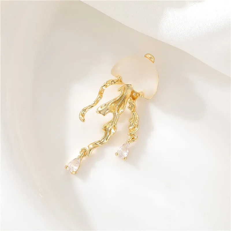 18K gold titanium steel openwork jellyfish pendant on silver O-ring chain against white background