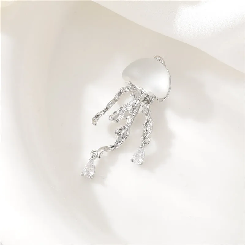 18K gold titanium steel openwork jellyfish pendant on silver O-ring chain against white background