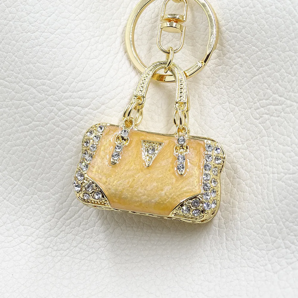 Alloy pendant keychain with enamel diamond cloud pattern in gold colour on keyring