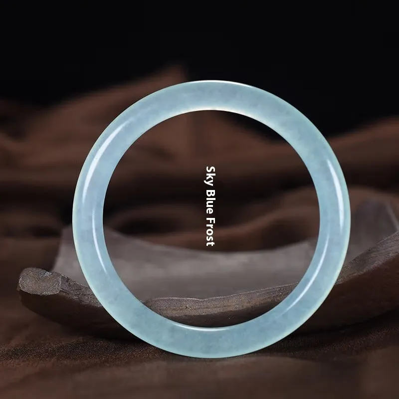 Azure light blue water ice quartzite jade thin round bar bracelet on white background