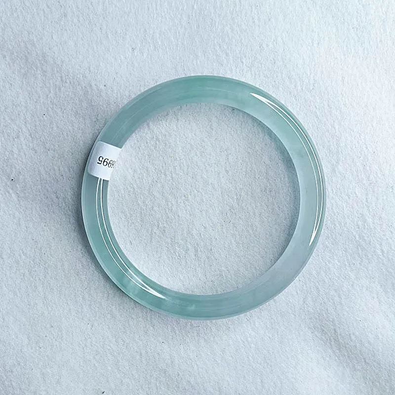 Azure light blue water ice quartzite jade thin round bar bracelet on white background