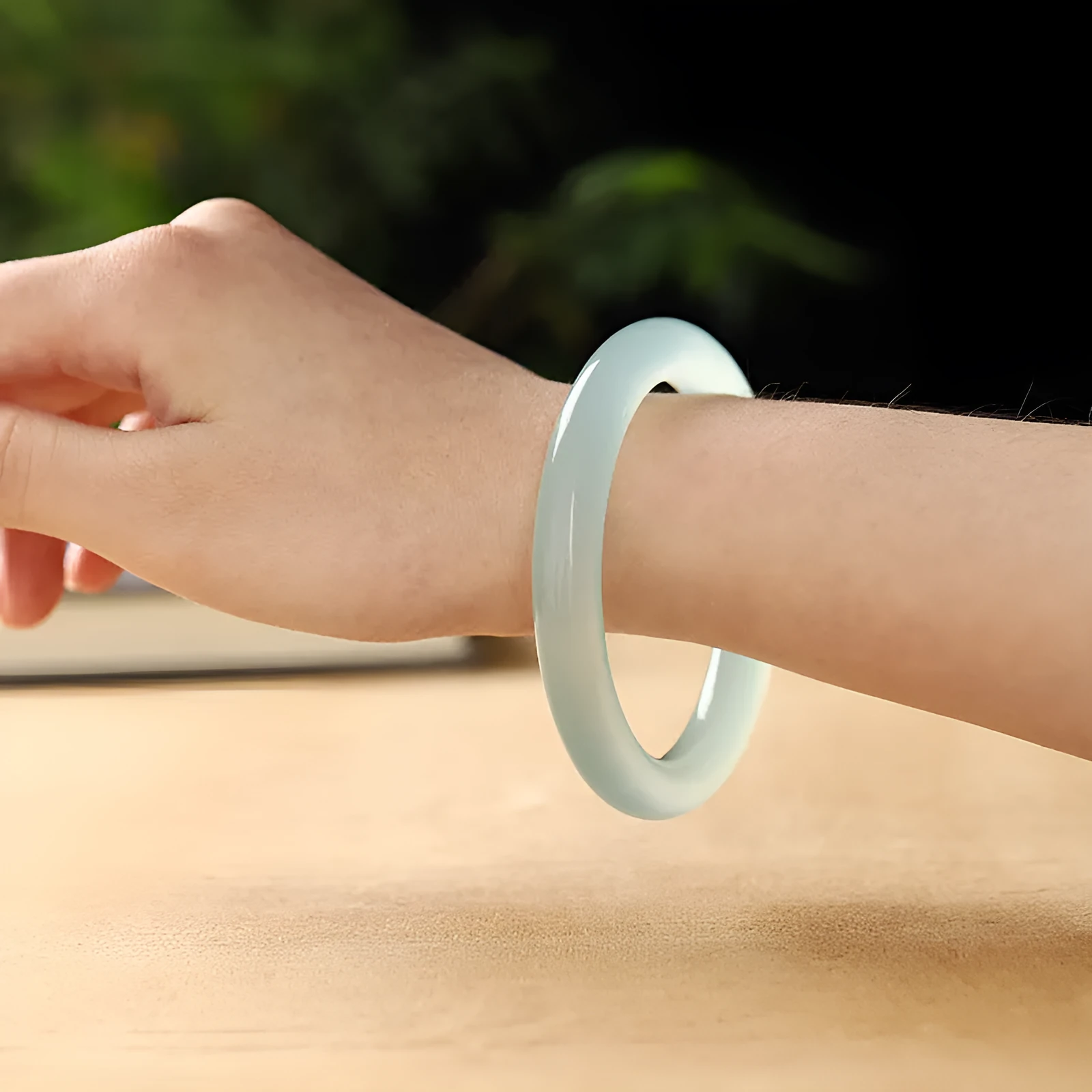 Azure light blue water ice quartzite jade thin round bar bracelet on white background