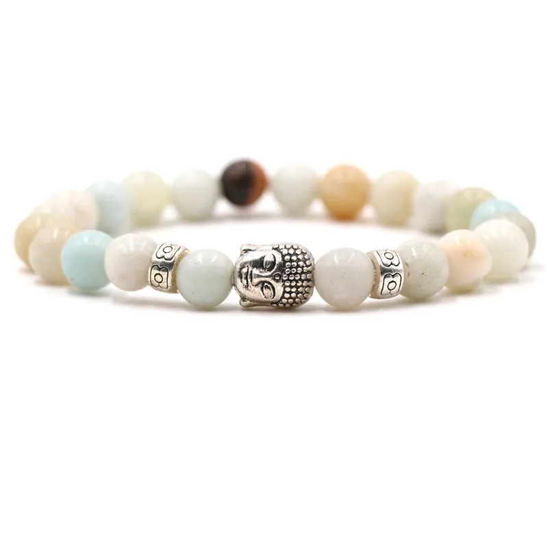 Natural stone stretch bracelet with round 8mm beads on a black background, showing Tigereye and turquoise colour options.
