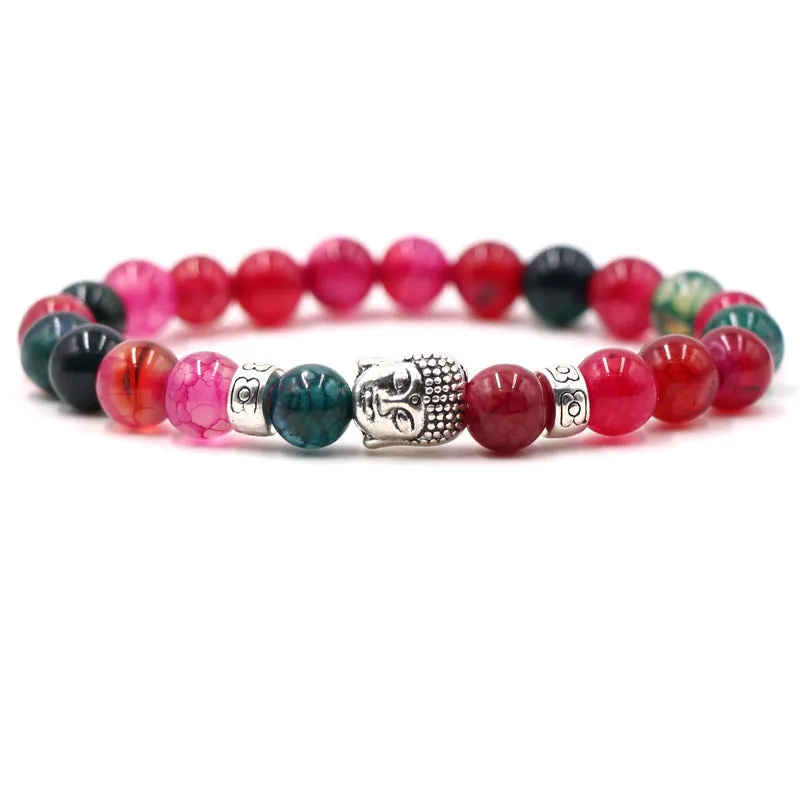 Natural stone stretch bracelet with round 8mm beads on a black background, showing Tigereye and turquoise colour options.