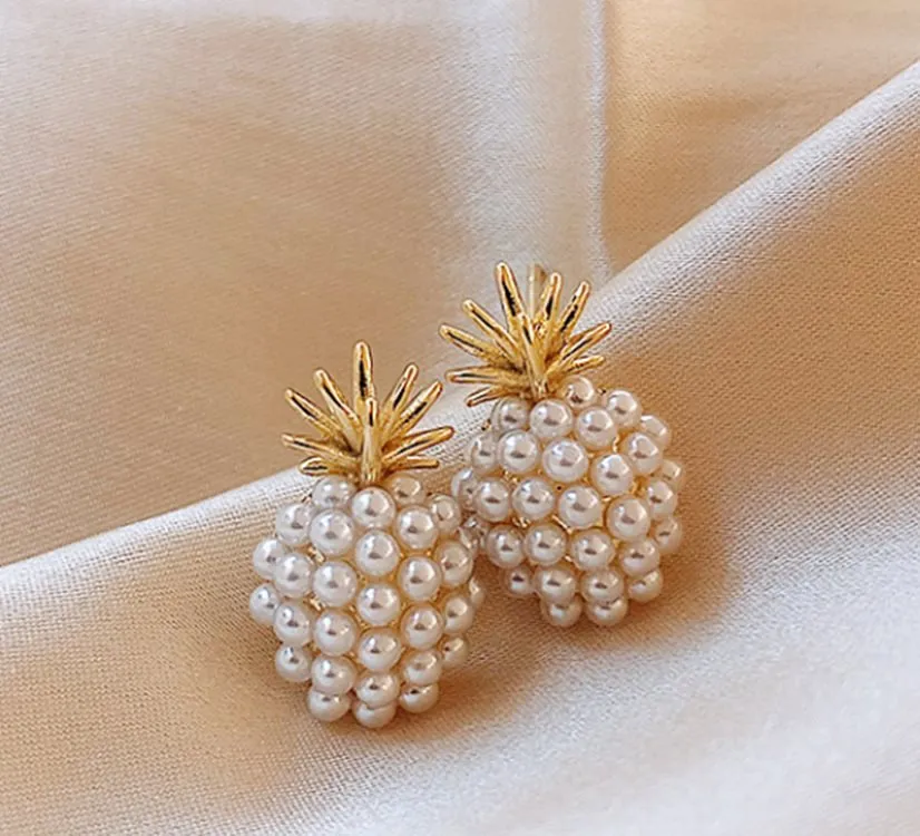 Korean style alloy earrings with pineapple and starfish motifs in gold colour, featuring inlaid artificial gems