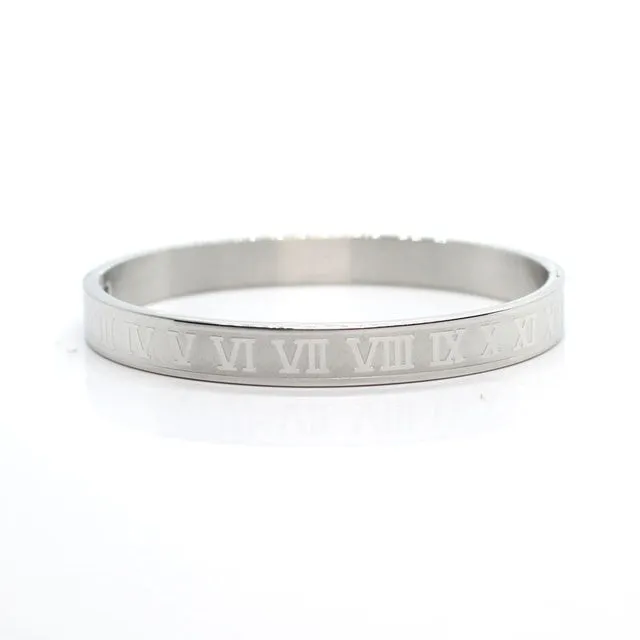 316L stainless steel bangle bracelet in silver finish with smooth surface on neutral background