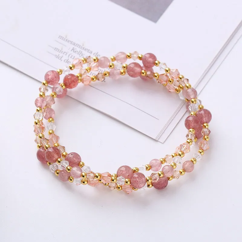 Women's three-ring crystal bracelet with tourmaline, strawberry quartz, and amethyst beads on adjustable rope.
