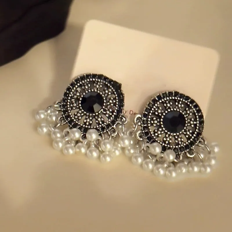 Pair of Miao maiden pearl earrings in round geometric shape with electroplating finish
