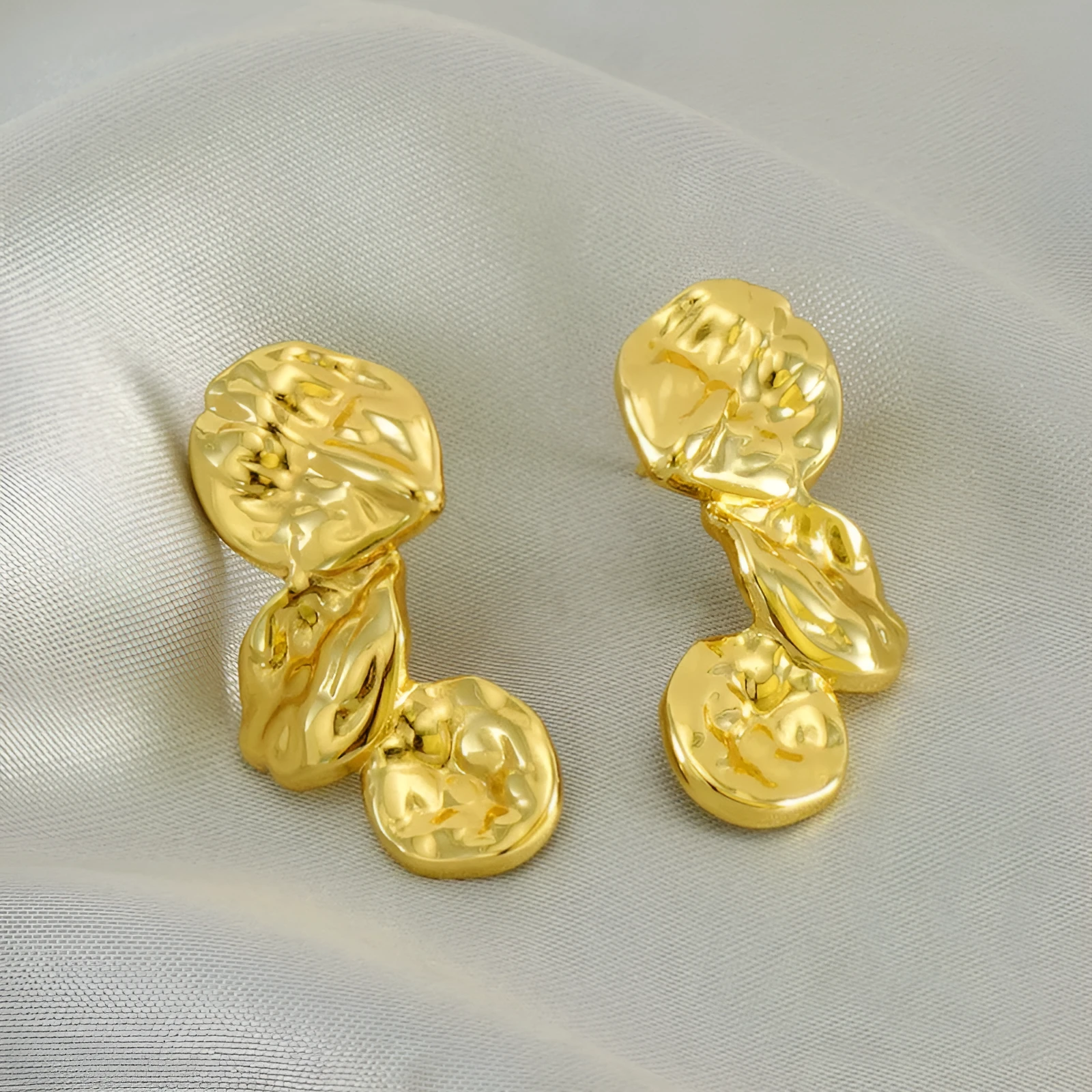Gold stainless steel vintage petal earrings with irregular geometric shape and asymmetric folding design