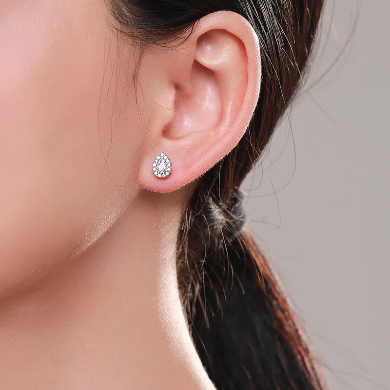 Women's silver water drop shaped ear studs made from 925 sterling silver with diamond treatment