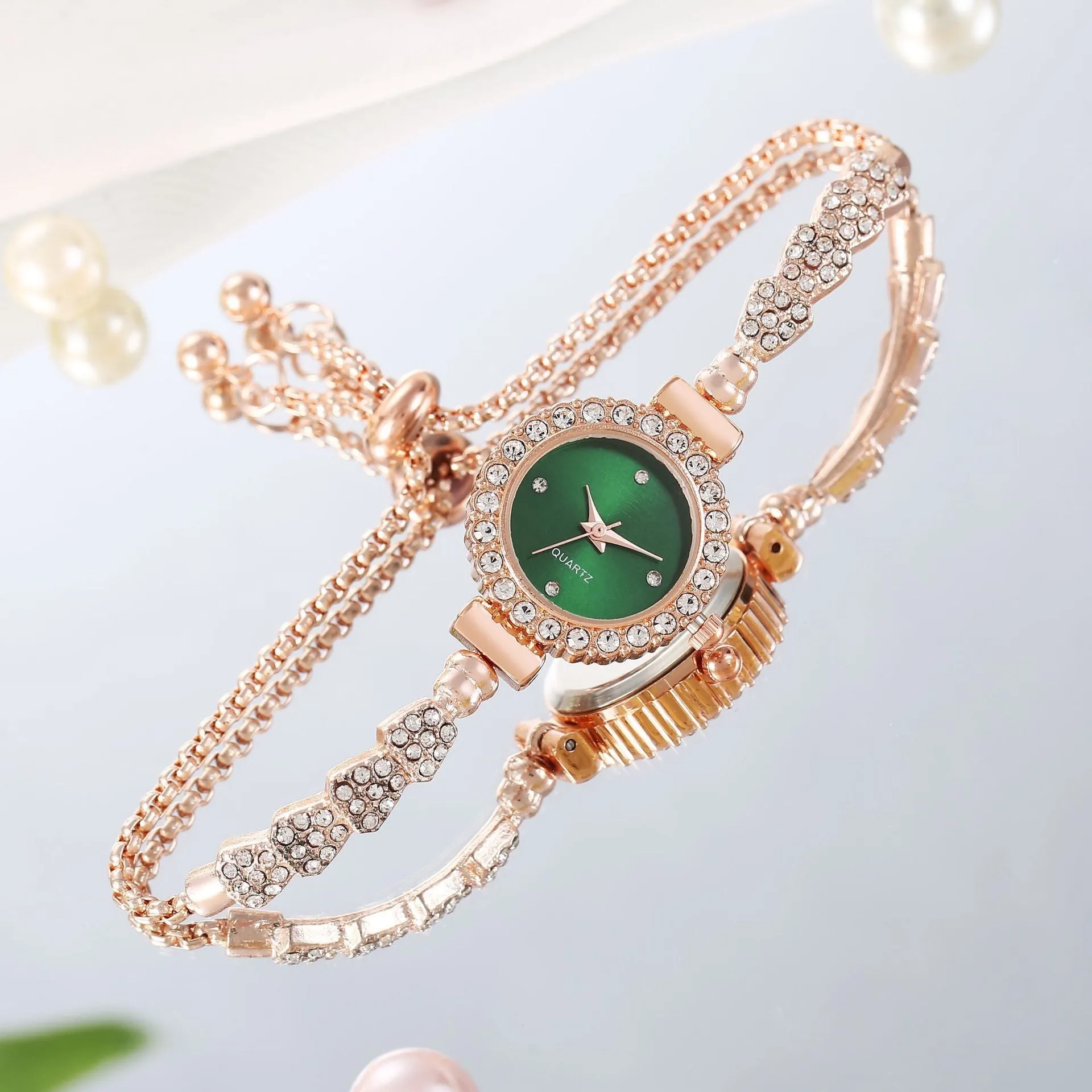 Gold fine strap women's watch with round dial and stainless steel jewellery buckle