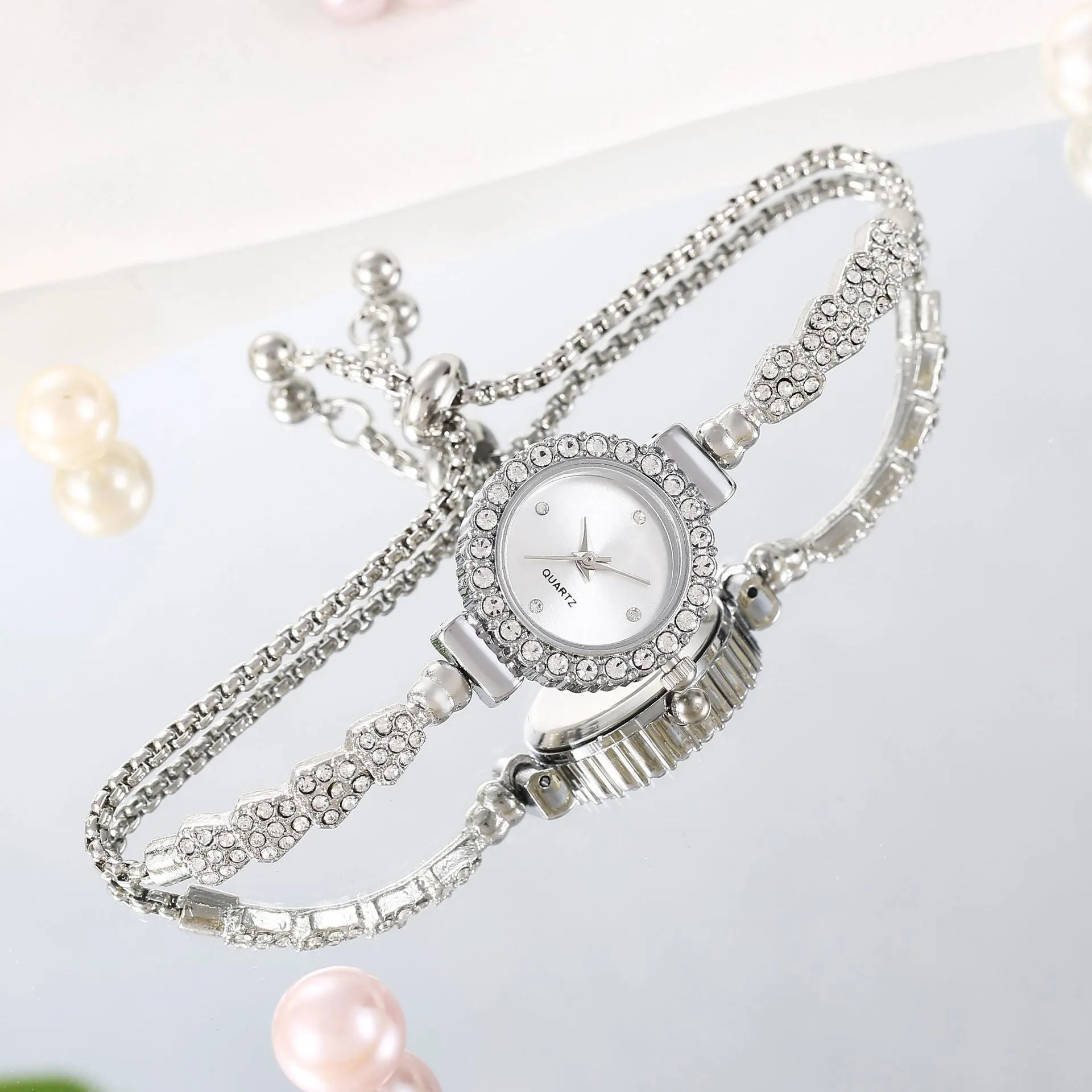 Gold fine strap women's watch with round dial and stainless steel jewellery buckle
