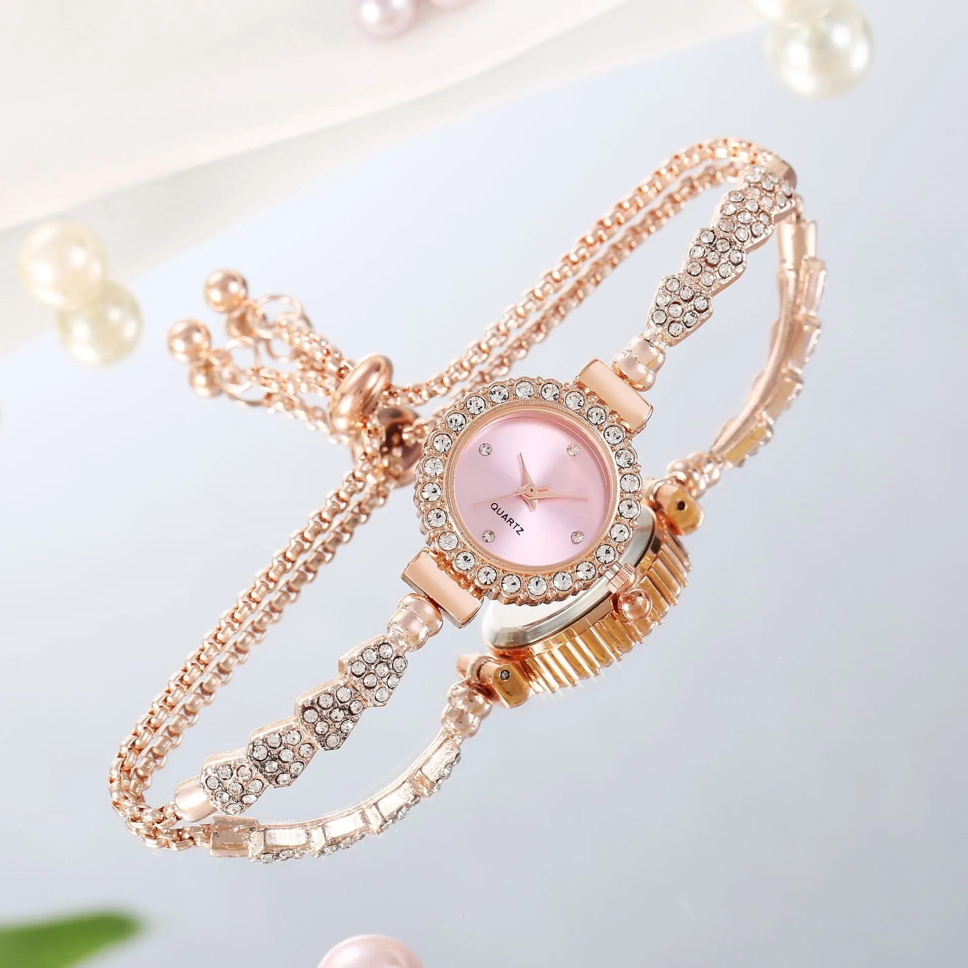 Gold fine strap women's watch with round dial and stainless steel jewellery buckle
