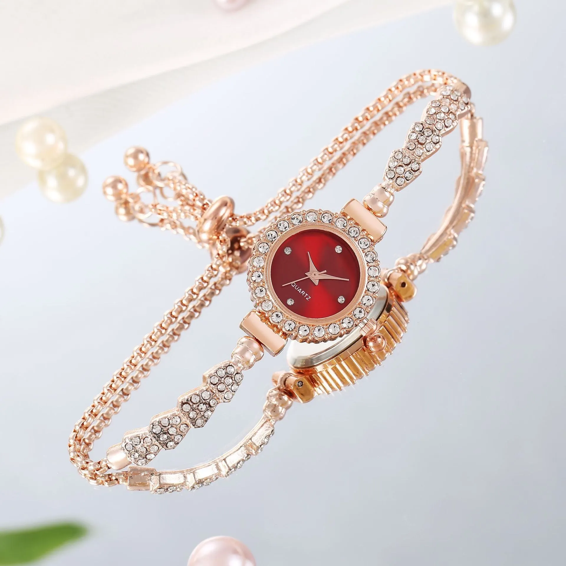 Gold fine strap women's watch with round dial and stainless steel jewellery buckle