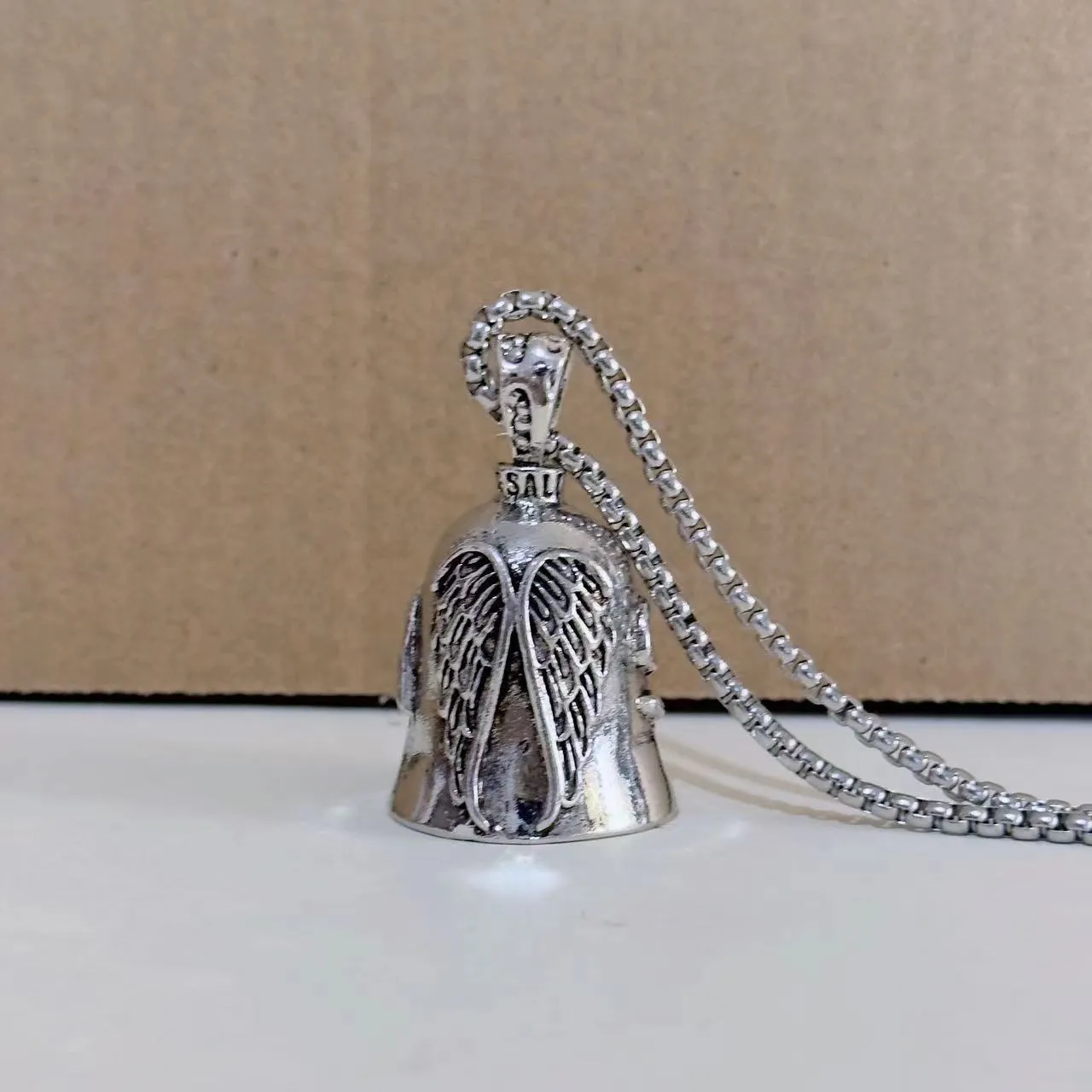 Vintage angel feather design necklace and matching keychain set in white alloy metal.
