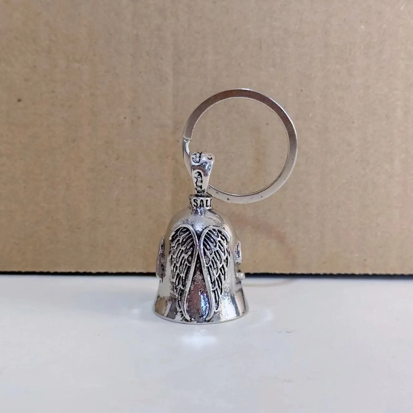Vintage angel feather design necklace and matching keychain set in white alloy metal.