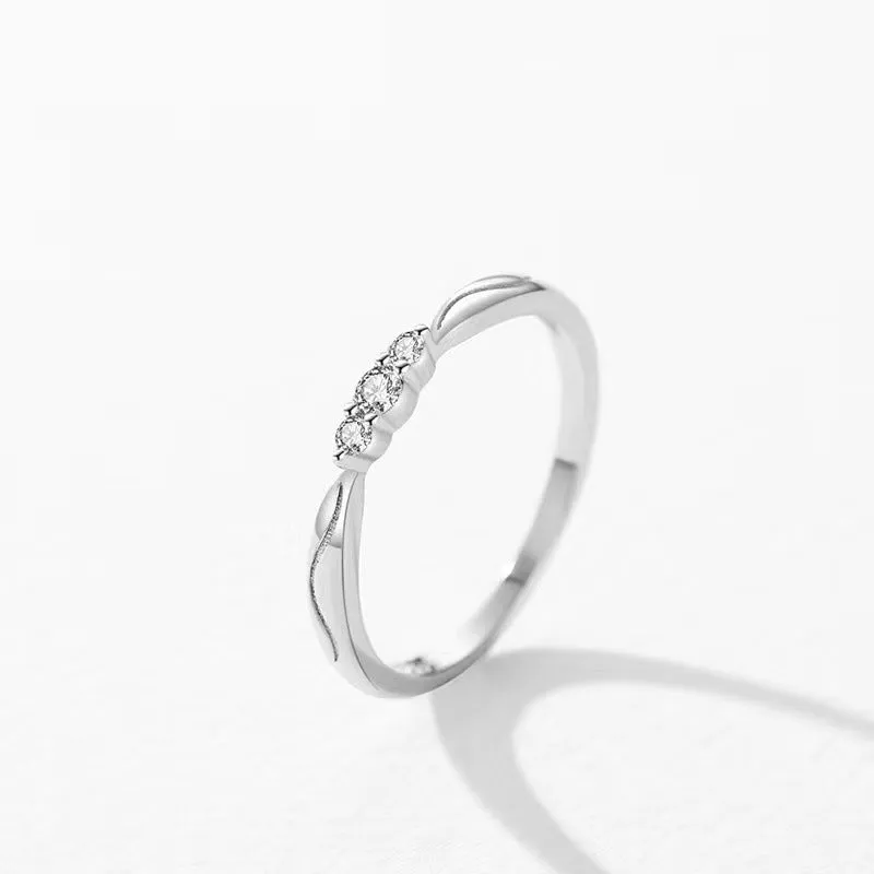 S925 sterling silver ripple wave ring with white gold electroplated finish on white background