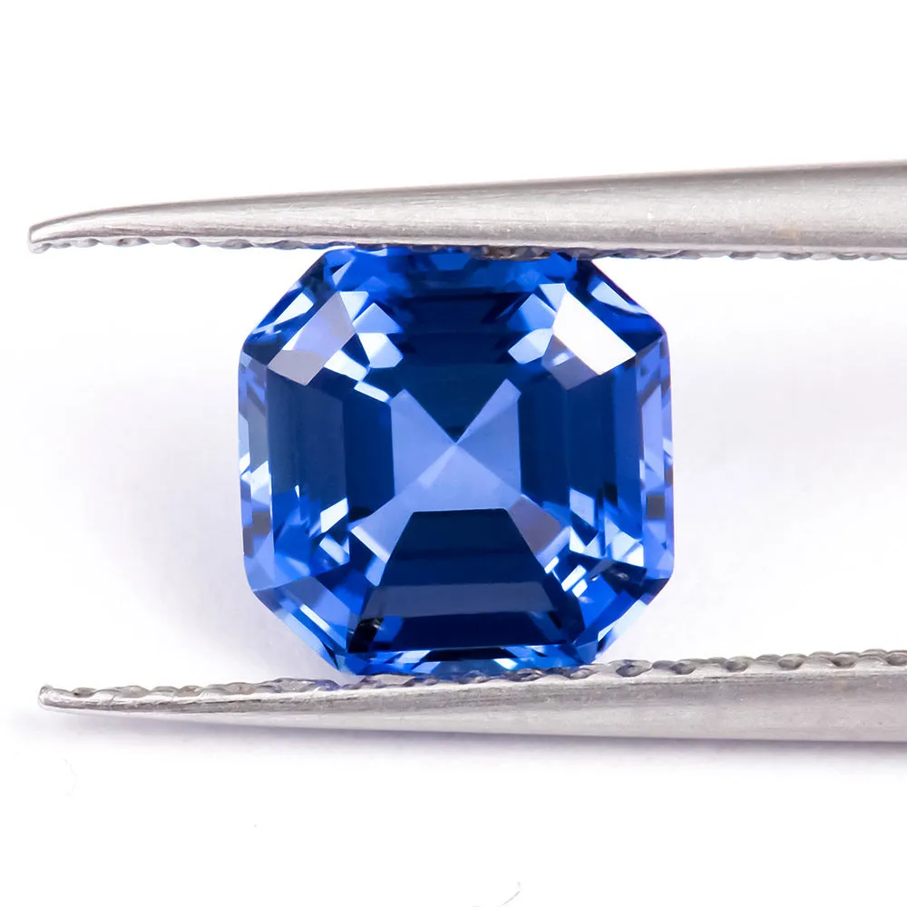 Royal blue heart shaped tiara gemstone jewellery component on white background.