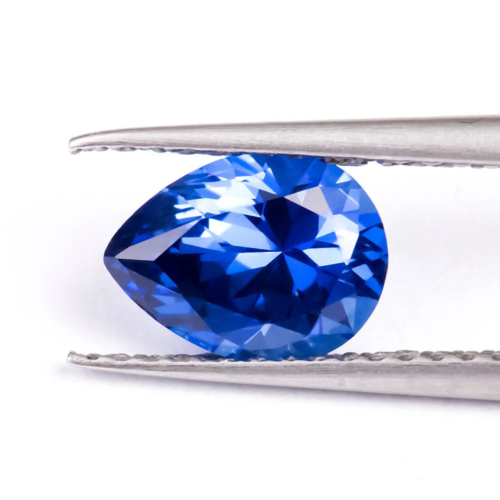 Royal blue heart shaped tiara gemstone jewellery component on white background.