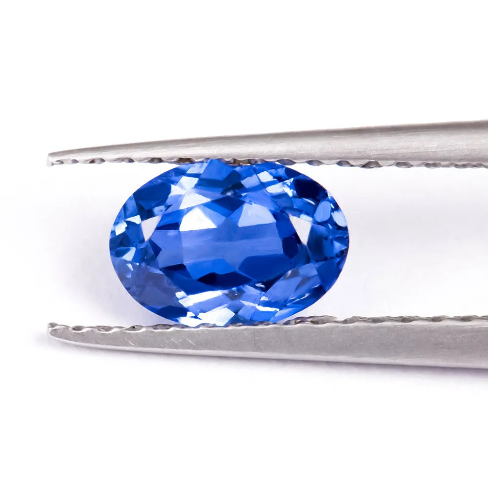 Royal blue heart shaped tiara gemstone jewellery component on white background.