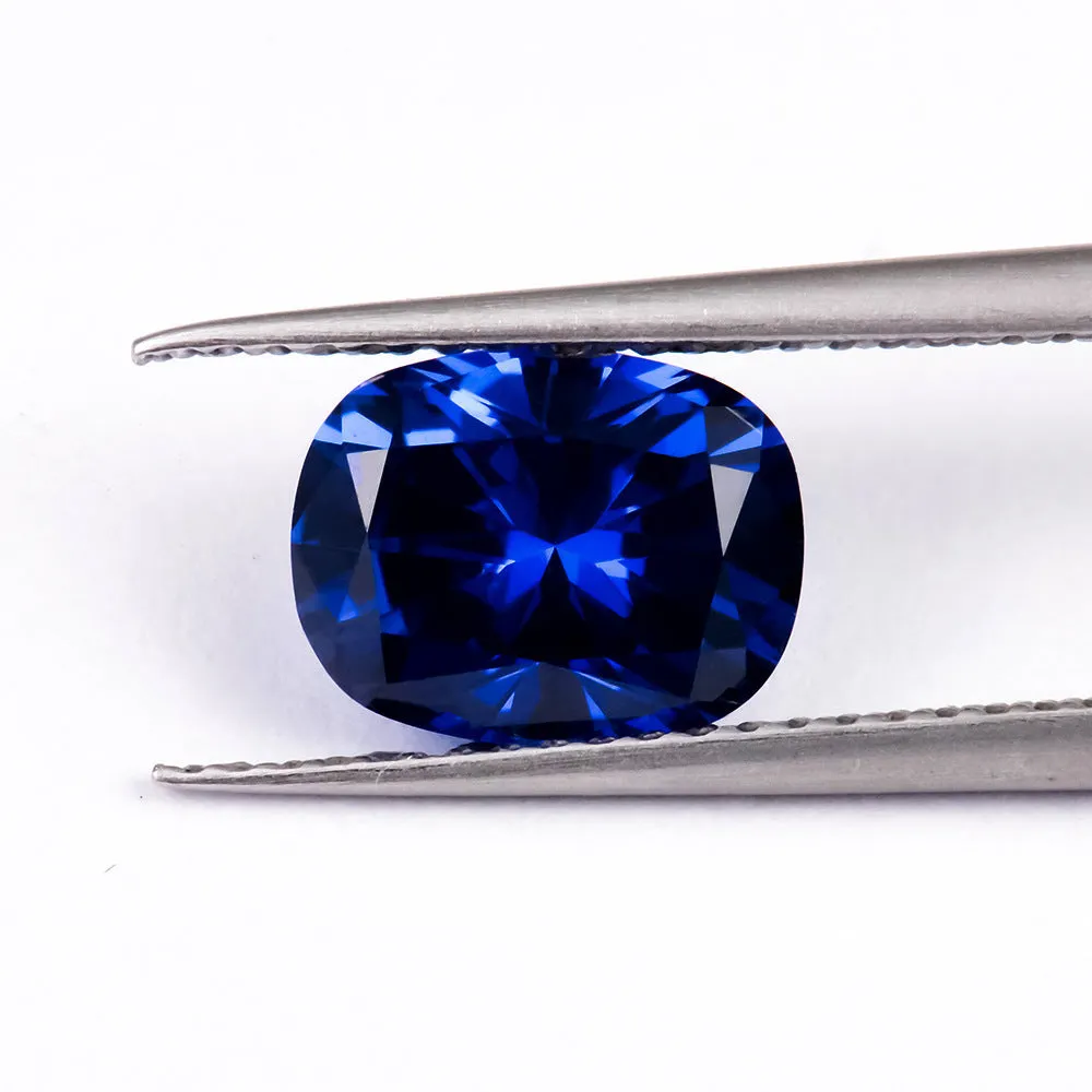 Royal blue heart shaped tiara gemstone jewellery component on white background.