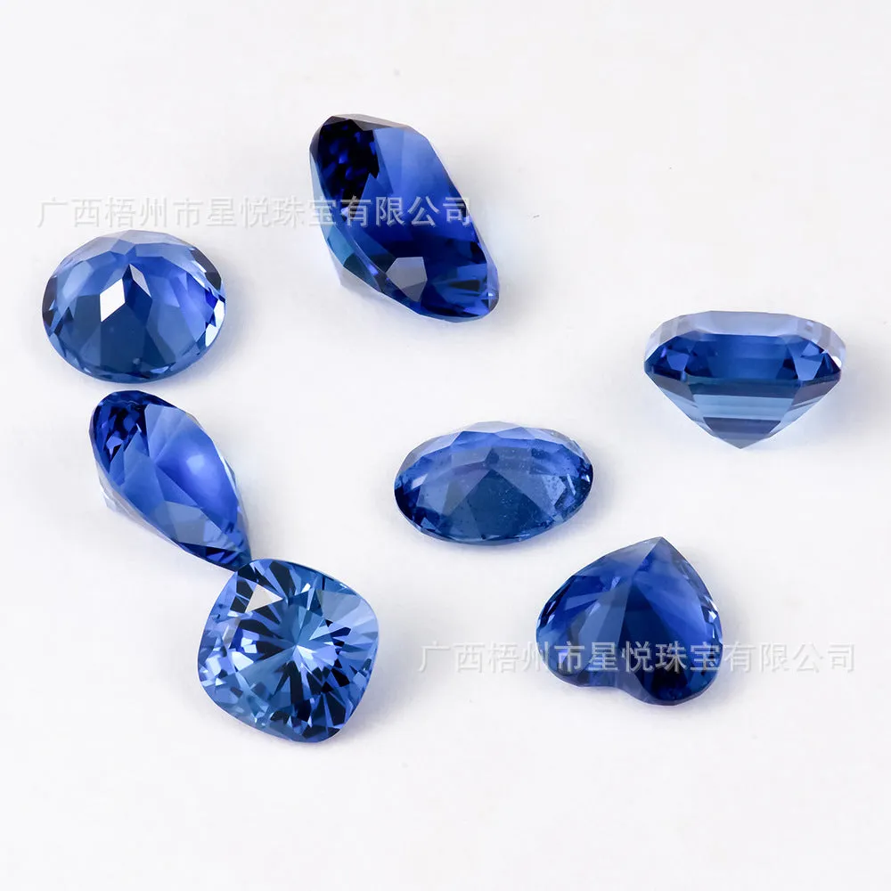 Royal blue heart shaped tiara gemstone jewellery component on white background.
