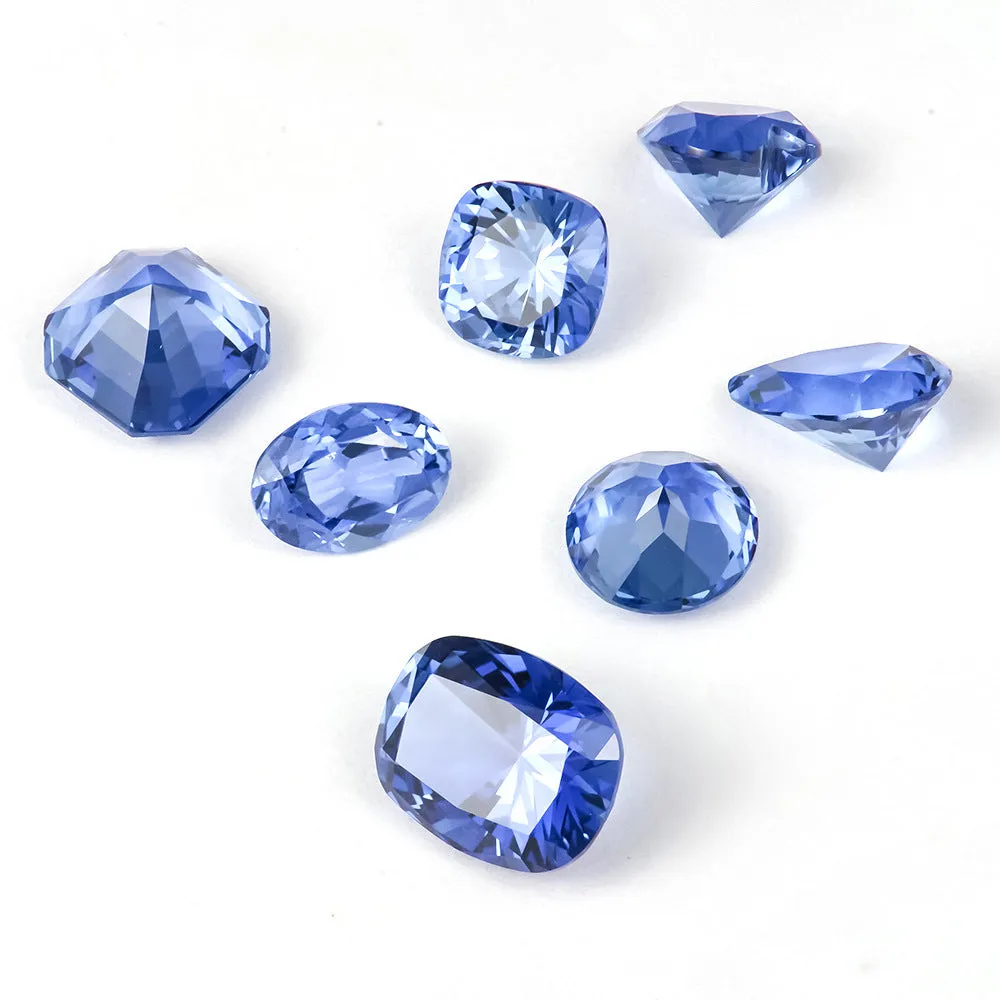 Royal blue heart shaped tiara gemstone jewellery component on white background.