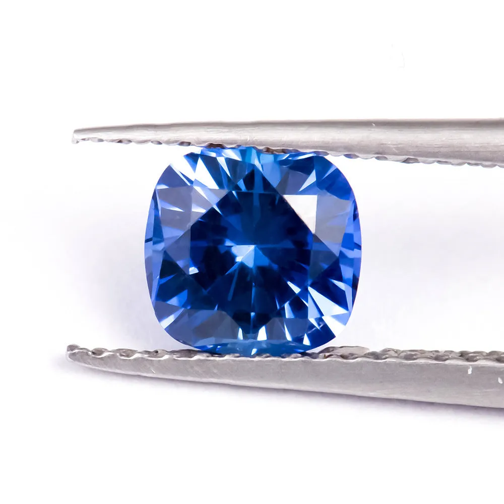 Royal blue heart shaped tiara gemstone jewellery component on white background.