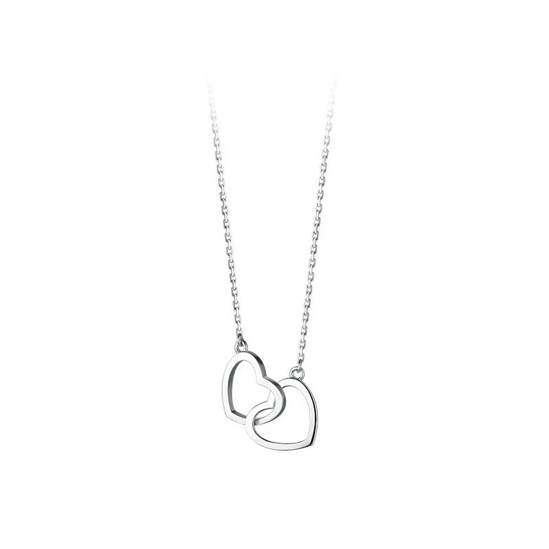 Double heart interlocking titanium steel necklace in gold on a white background with cross chain substyle