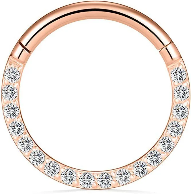 A round stainless steel seamless nose ring on a grey background, shown in a gold plated finish.