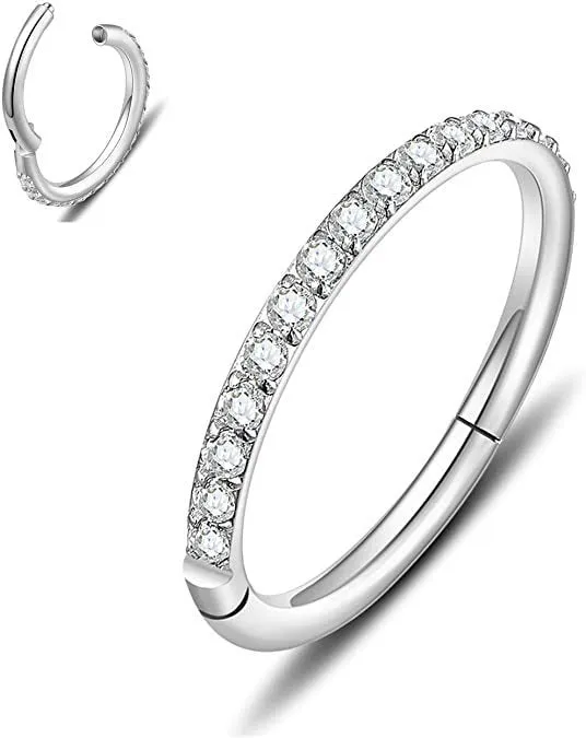 A round stainless steel seamless nose ring on a grey background, shown in a gold plated finish.