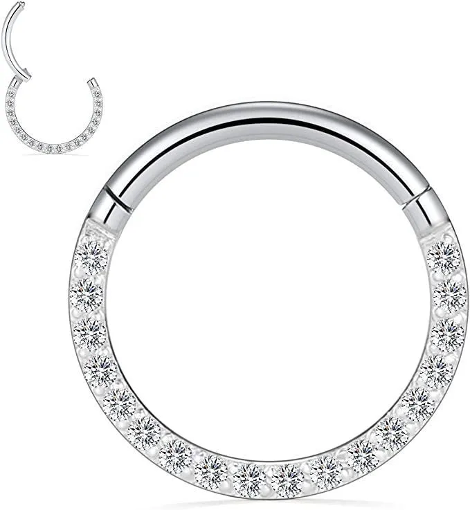 A round stainless steel seamless nose ring on a grey background, shown in a gold plated finish.