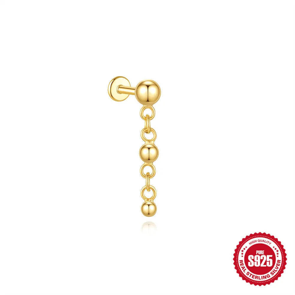 Close-up of a geometric water drop earring made from S925 sterling silver with a flat spiral puncture finding in a gold colour finish.